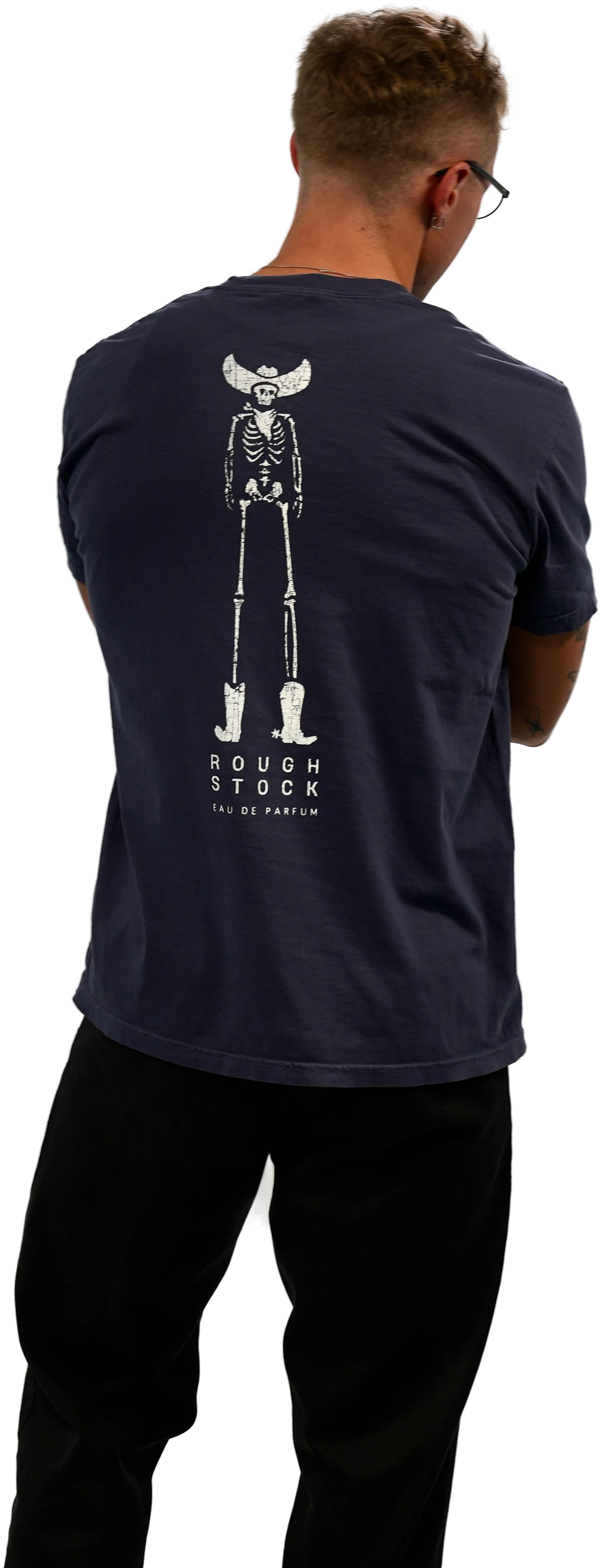 Worn from behind: the vintage-wash navy tee with the ROUGH STOCK print across the back.